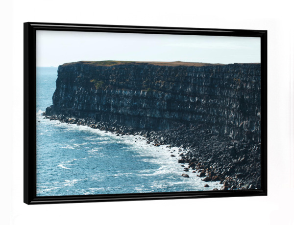 Poster mit schwarzem Rahmen "Felsige Klippe in Island" artboxONE - Natur,Reise,Reise / Länder