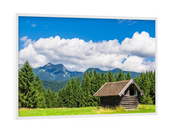 Poster mit weißem Rahmen "Wiese, Holzhütte, Wolken, Wald" artboxONE - Natur,Reise,Architektur