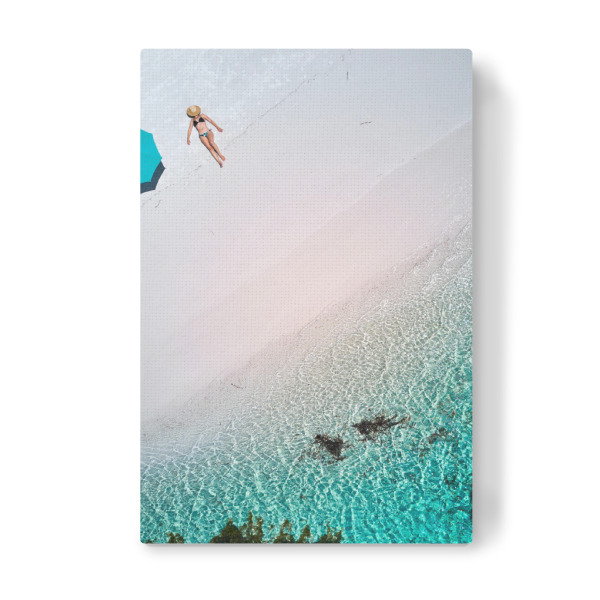 Leinwandbild "Lady laying at the Beach" artboxONE - Natur,Reise / Strand und Meer - Beach,Beachday,Swimming,Ocean,Drone,Waves